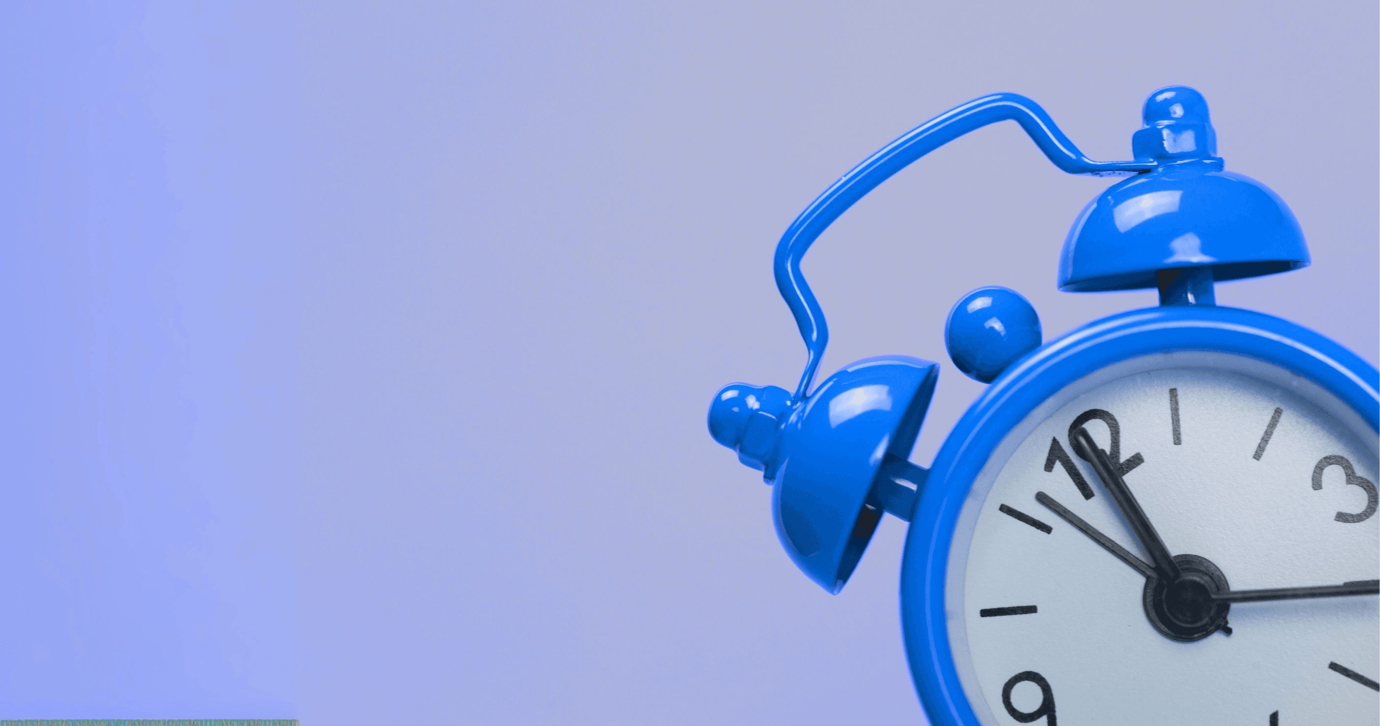 Blue vintage alarm clock showing 7:00 against a gradient blue background, with only half of the clock visible.