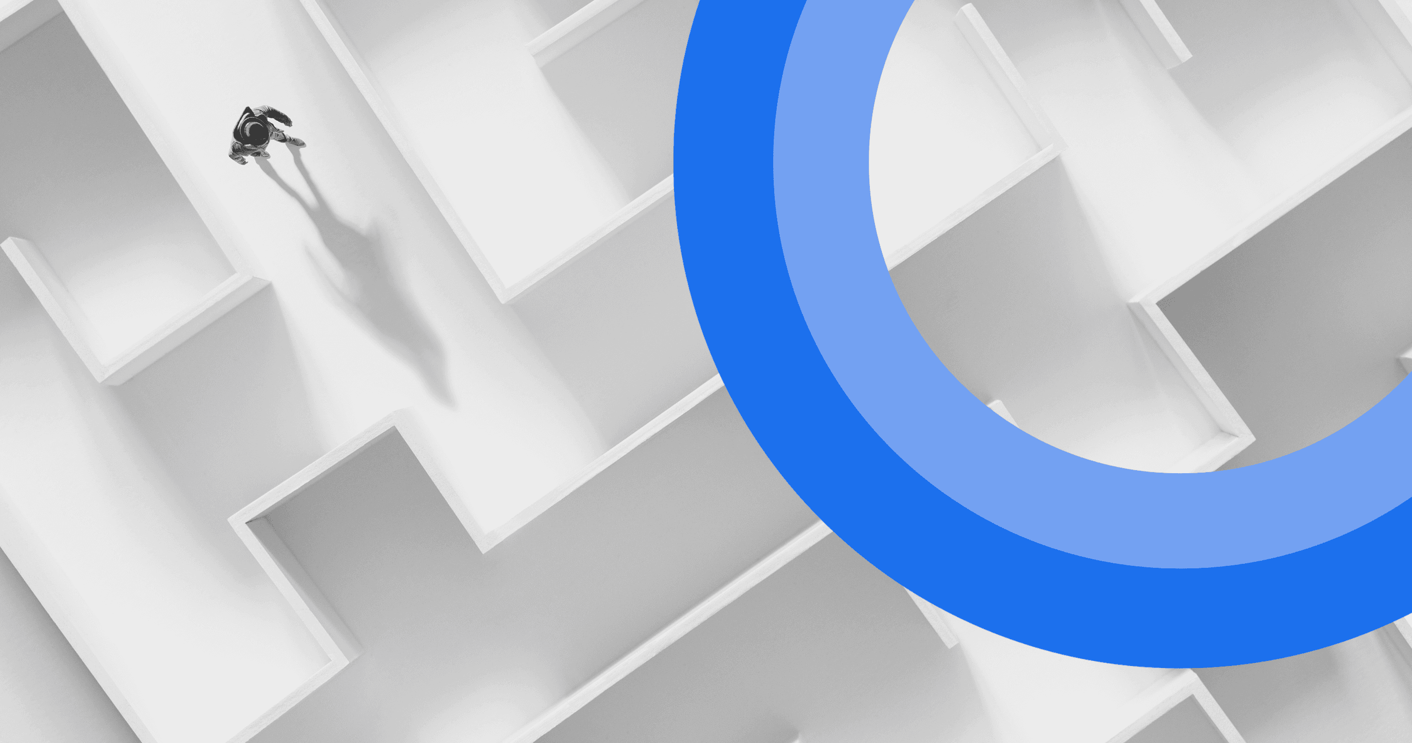 man walking in a complex white maze with blue ring