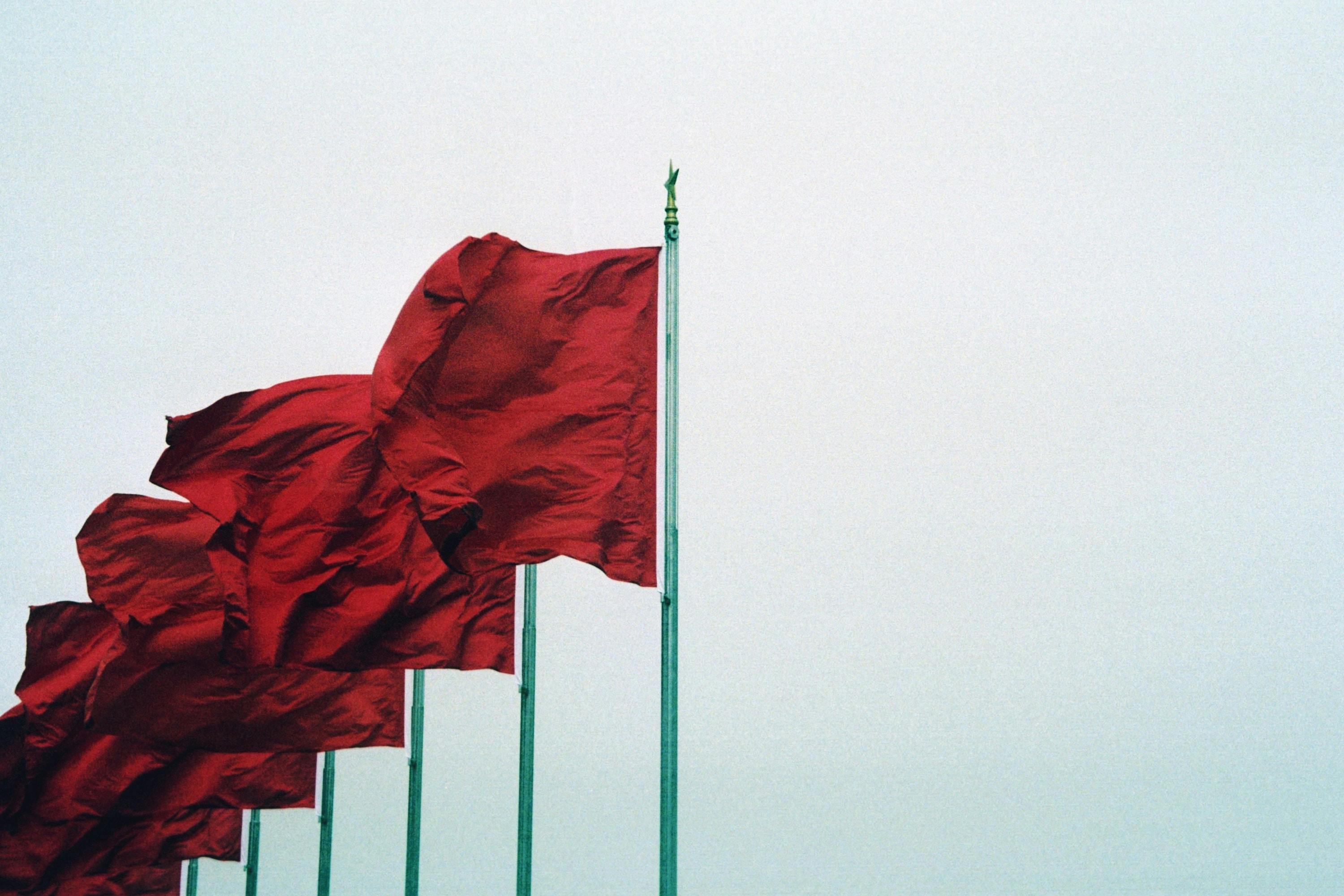 Red flags blowing in the wind